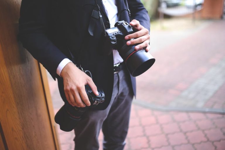 man hands photographer cameras 768x512